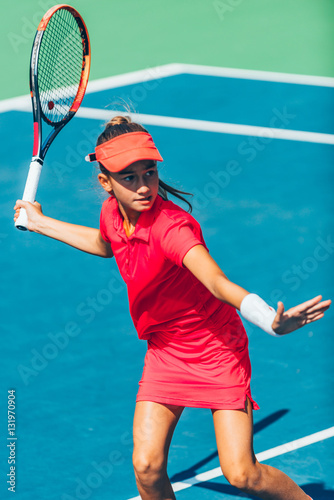 Tennis match. Girl playing tennis