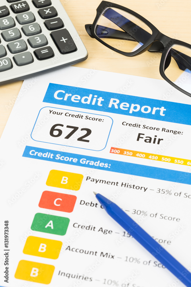Fair credit score report with pen and calculator; document and t Fair credit score report with pen and calculator; document and t