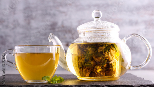 Herbal tea in a glass pot