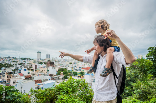 Happy tourists dad and son in LongSon Pagoda photo