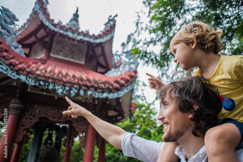 Happy tourists dad and son in LongSon Pagoda photo