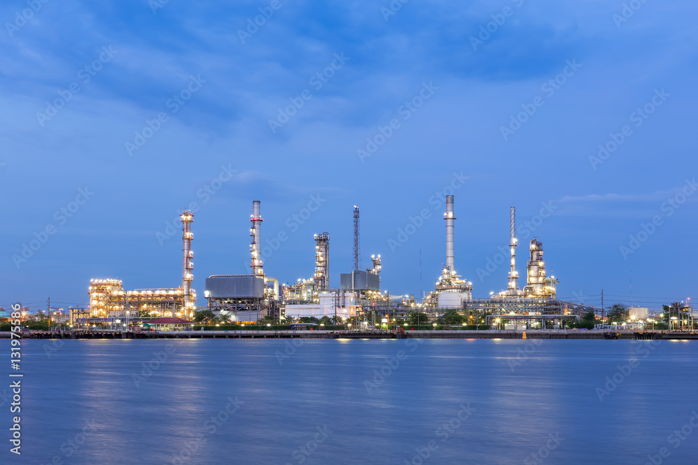 Oil refinery on water front at twilight Oil refinery on water front at twilight