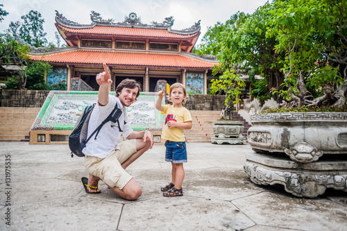 Happy tourists dad and son in LongSon Pagoda photo