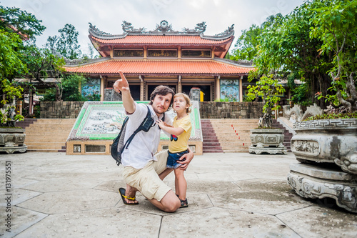 Happy tourists dad and son in LongSon Pagoda photo