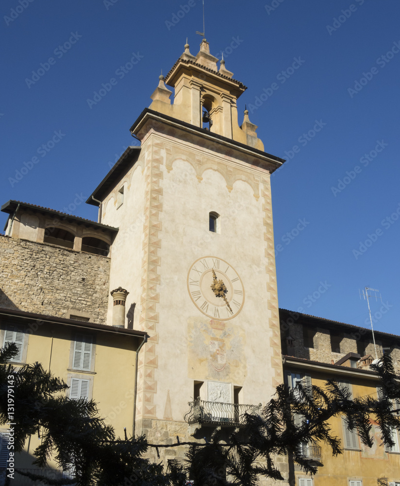 Bergamo - Old city (Citta Alta). One of the beautiful city in Italy. Lombardia. The clock tower close to Roncalli historical building during a wonderful blue sky.