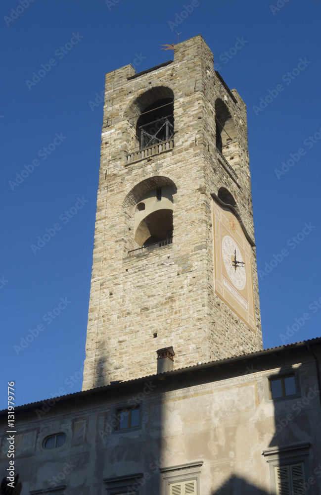 Bergamo - Old city (Citta Alta). One of the beautiful city in Italy. Lombardia. The clock tower called Il Campanone (the big bell) during a wonderful blue sky.