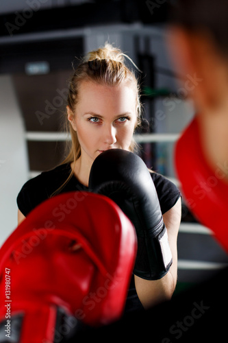 Young woman in boxing gloves © snedorez