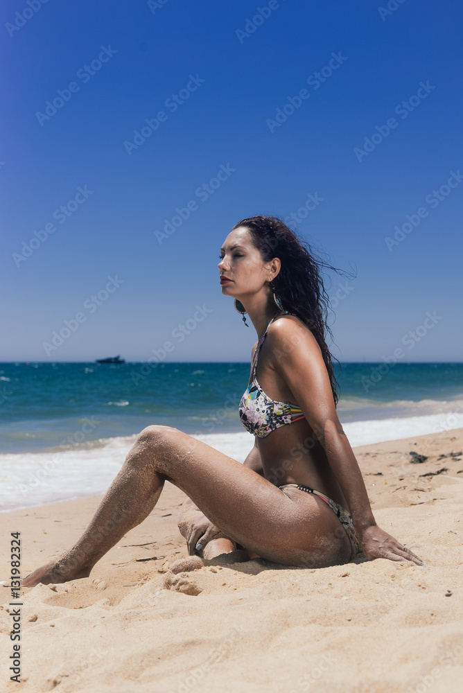 Beautiful joyful woman on sand beach sunny outdoors background