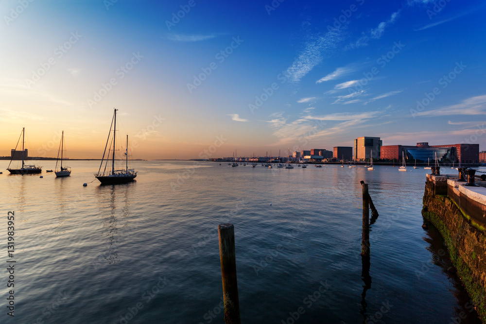 Moakley Federal Courthouse and World Trade Center face Boston Harbor sunrise