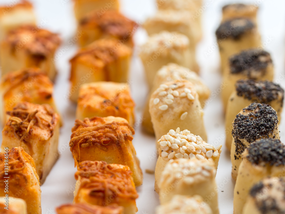 Salty party snacks stands in a row. Closeup details. Salty party snacks stands in a row. Closeup details.