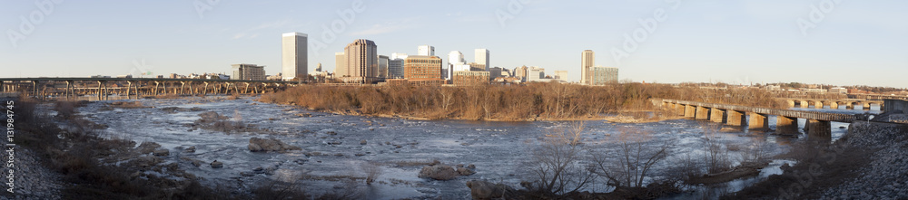 Winter, late afternoon in Richmond, Virginia looking north from the Manchester Floodwall Walk with the  James River in the foreground.