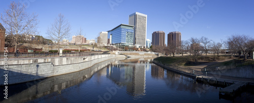 Late winter afternoon panorama in Richmond  Virginia looking north from under the Manchester Floodwall Walk with the T. Tyler Potterfield pedestrian bridge spanning the James River to the left. 