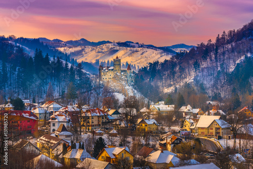 Fotografie Sunset light over medieval dracula Bran castle in winter season, Brasov, Transyl
