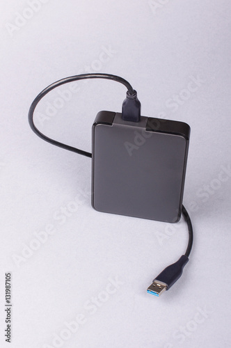 External 2.5'' hard drive HDD isolated on the gray background