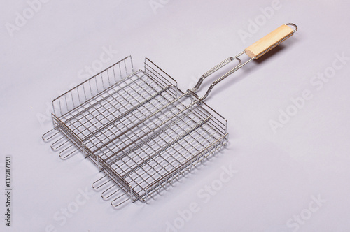 BBQ grill basket isolated on the gray background