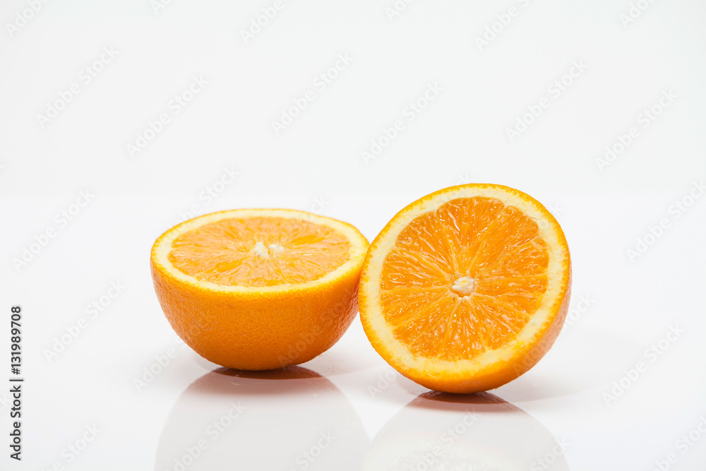 Fototapeta premium Half of oranges on white background 