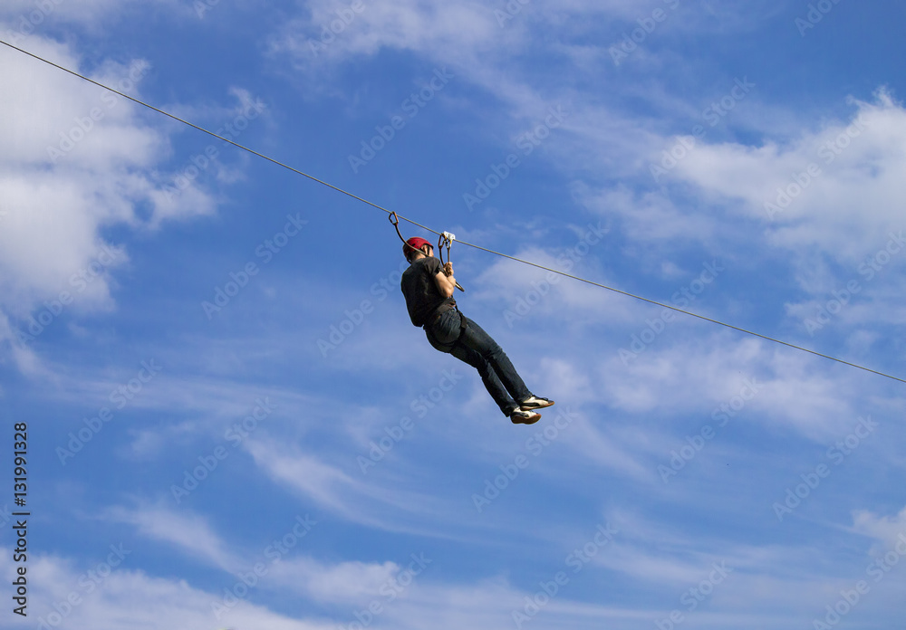 Adventurer going on a zip line