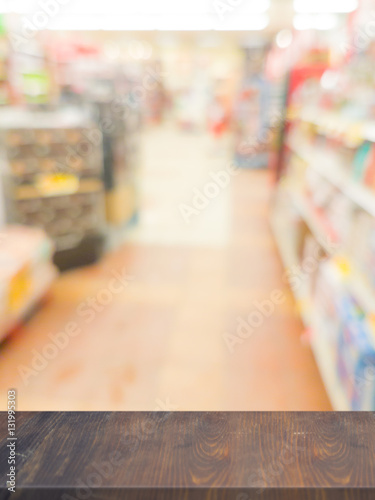 Empty wood table top on blurred in Supermarket Product Display