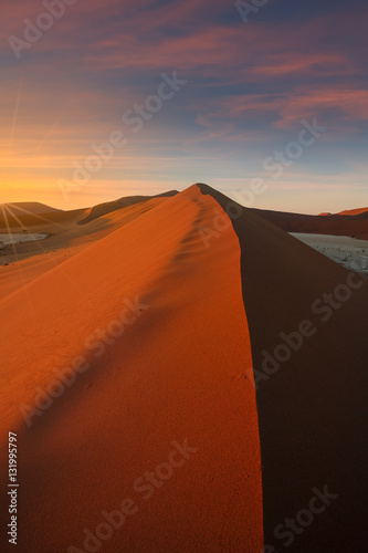 Morning light on the huge dune of sossusvlei in the namibian park of sessriem.