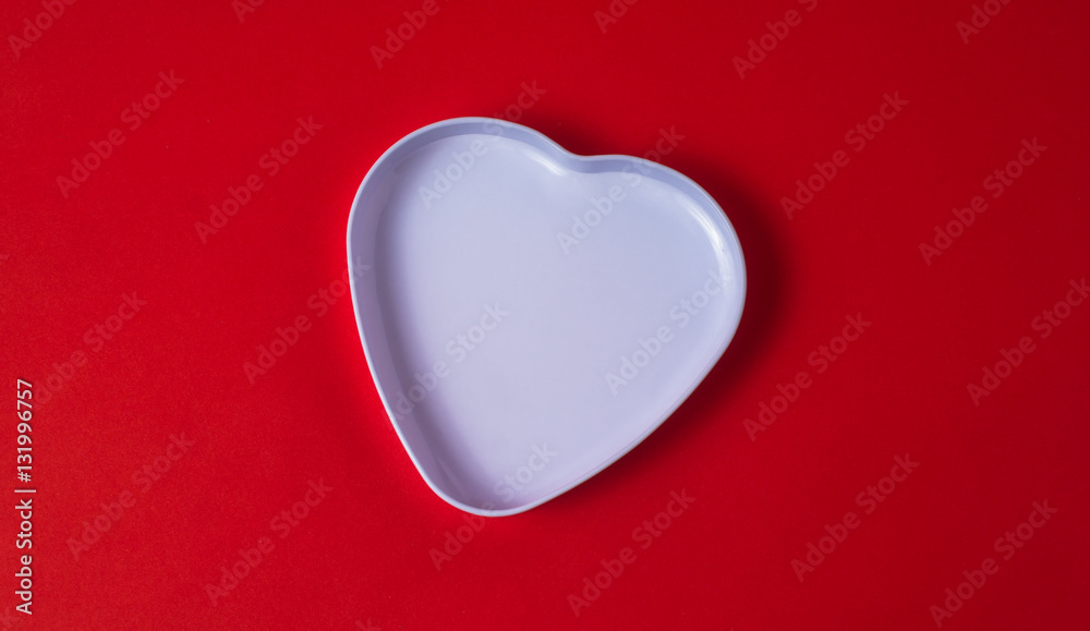 the heart-shaped box on red background the heart-shaped box on red background