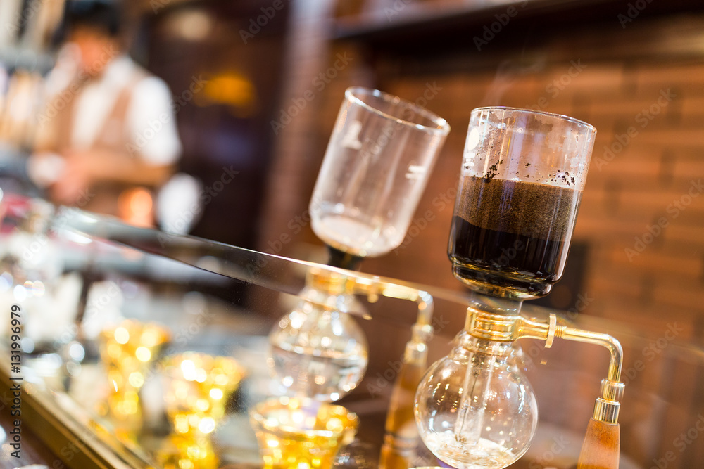 Coffee siphon in use