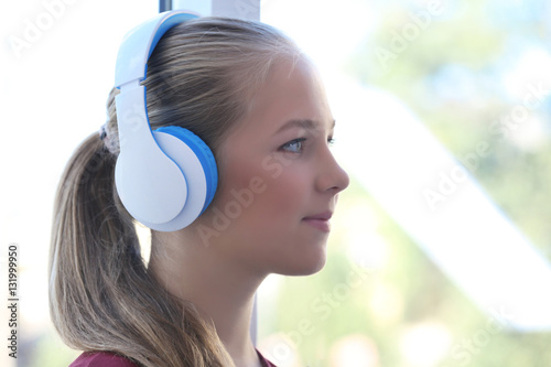 Cute teenager listening mus...
