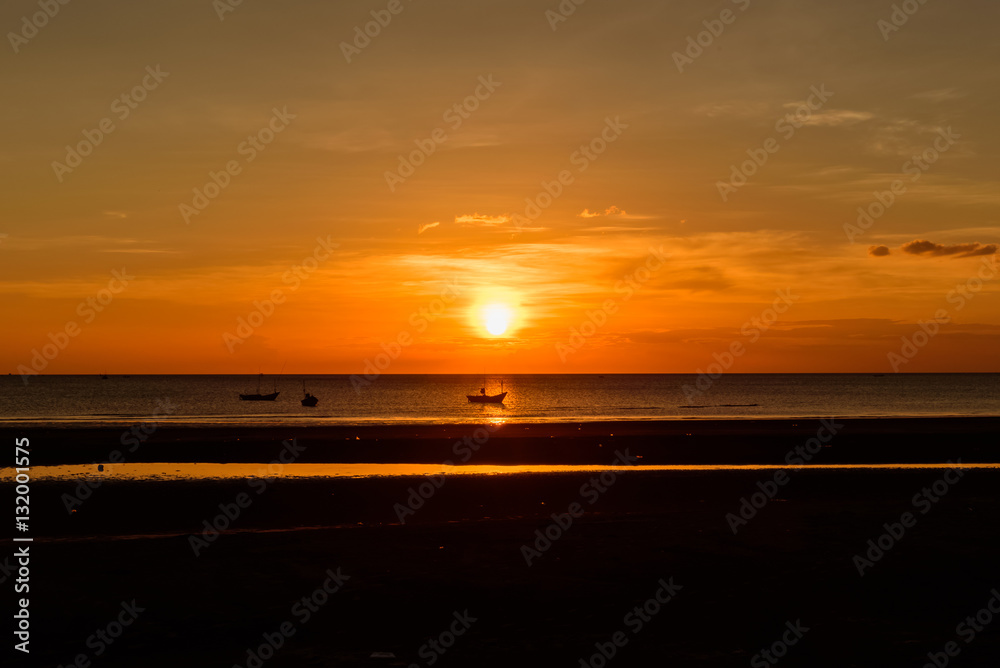 shadow  boat near light sunset on the beach