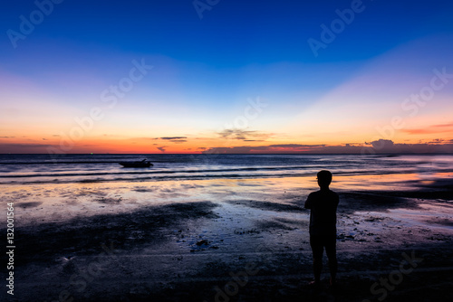 shadow  man  near light sunset on the beach