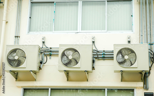 фотографія air condensing unit out side of wall