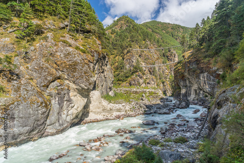 Hillary Suspension Bridge above the river, Everest region, Nepal photo