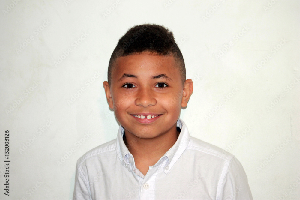 Young Biracial Boy Smiling on White Background Young Biracial Boy Smiling on White Background