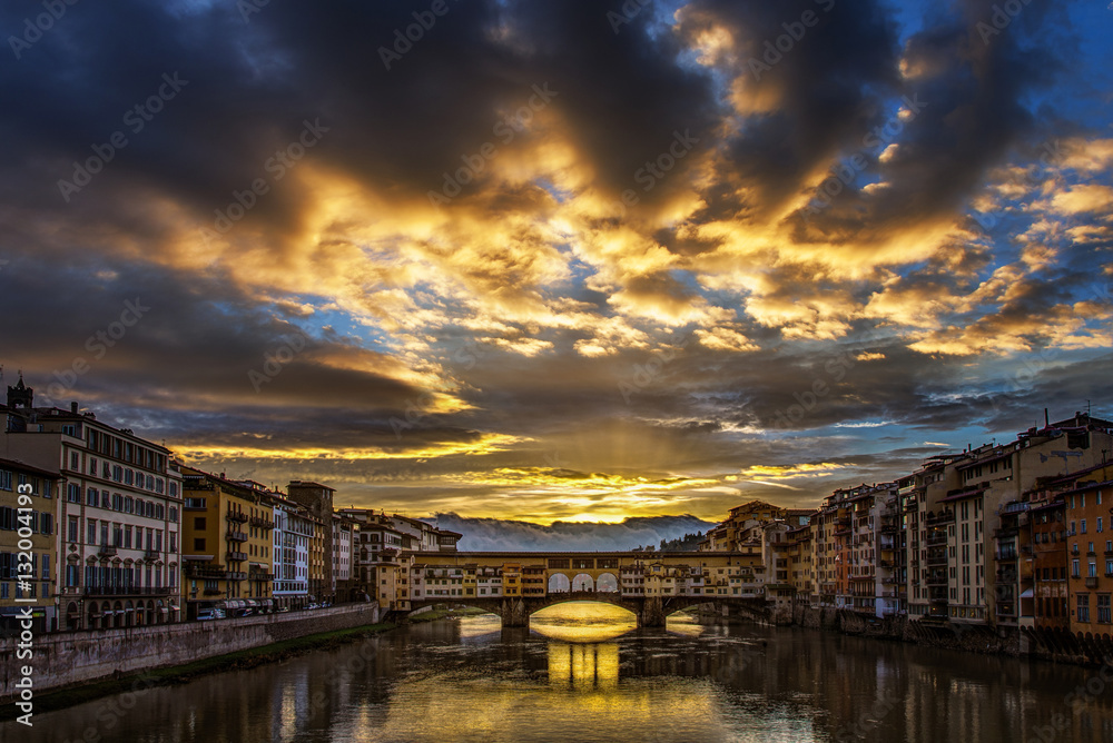 Storm clouds over Florence's Ponte Vecchio at sunrise