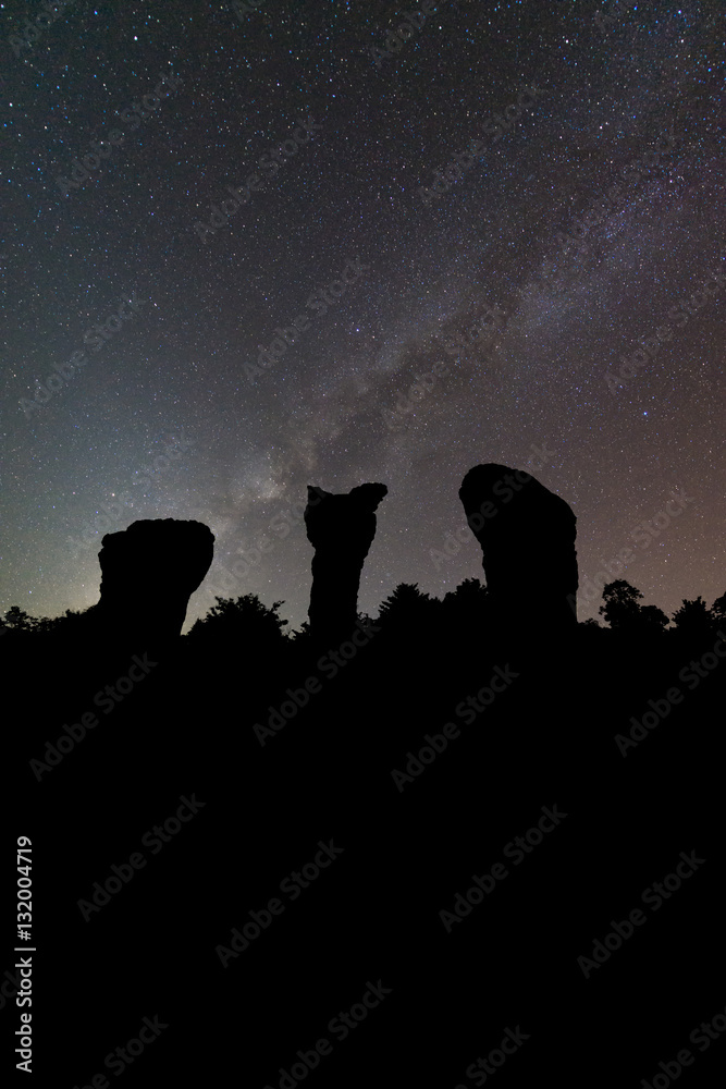 Silhouette stonehenge and milky way on background.Long exposure shooting and high iso used make this photo have noise