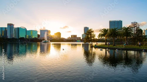 Sunset over the Eola lake timelapse, Eola Park, Orlando, Florida USA photo