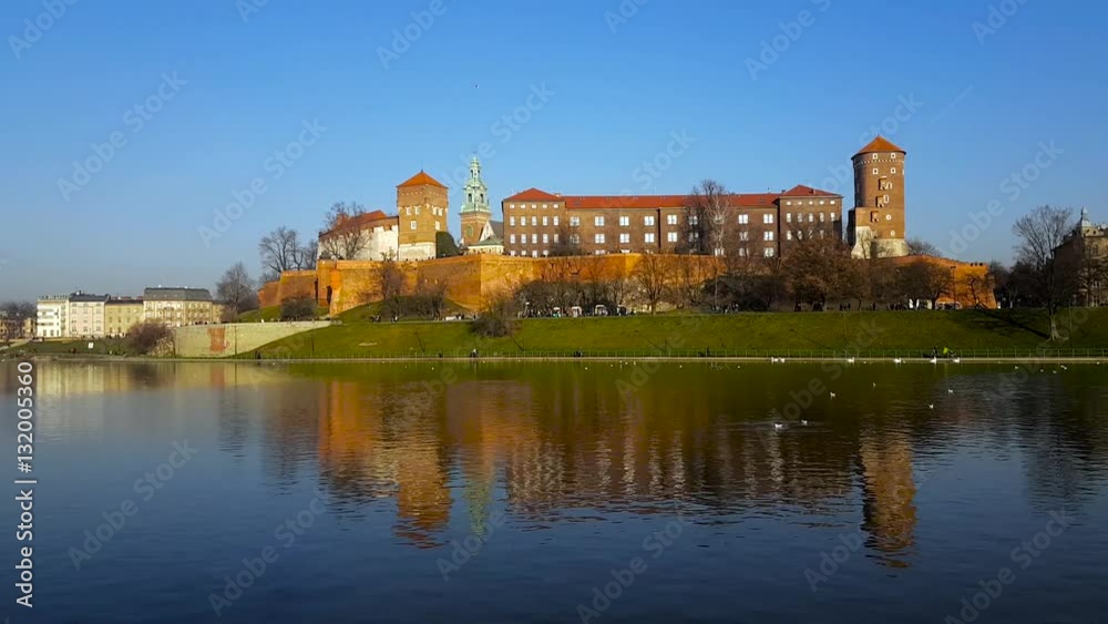 Famous landmark Wawel castle seen from Vistula, Krakow, Poland. Pan from left to right Famous landmark Wawel castle seen from Vistula, Krakow, Poland. Pan from left to right