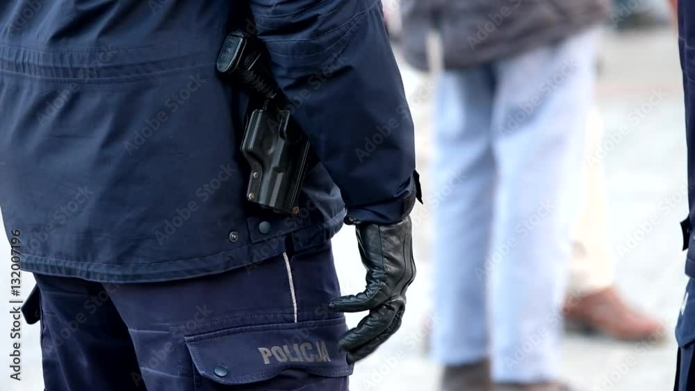 Armed with a pistol police man ready to use weapons Armed with a pistol police man ready to use weapons
