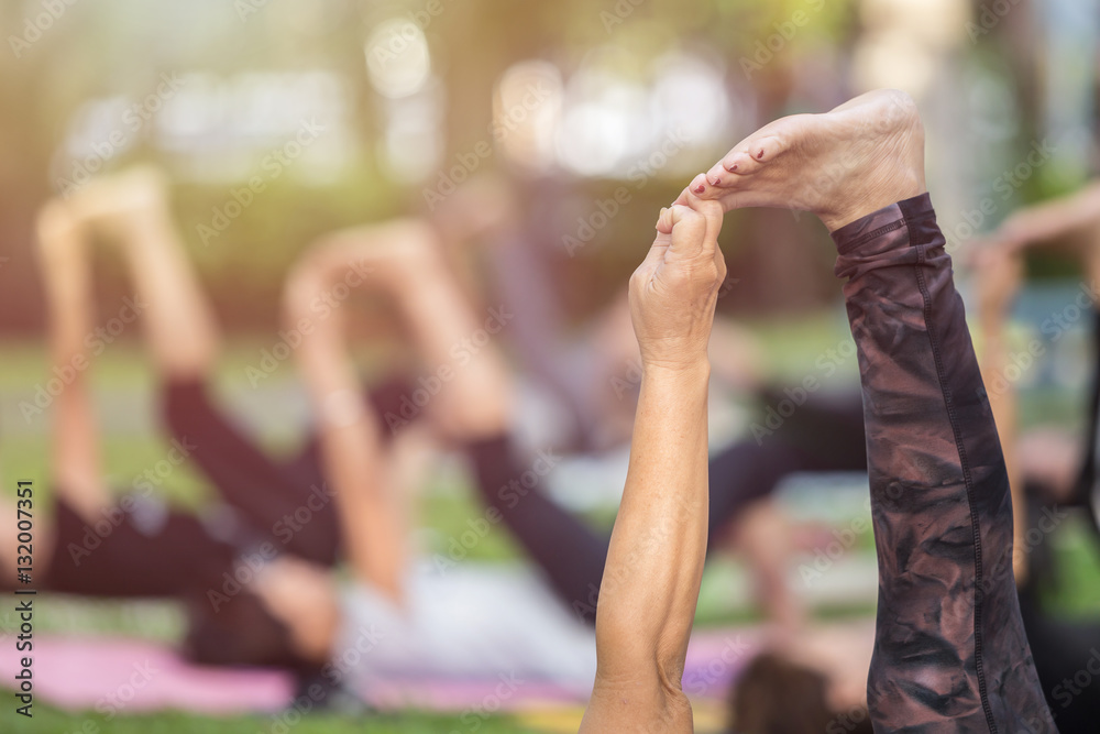Fototapeta premium Asian woman doing yoga or exercise in the park