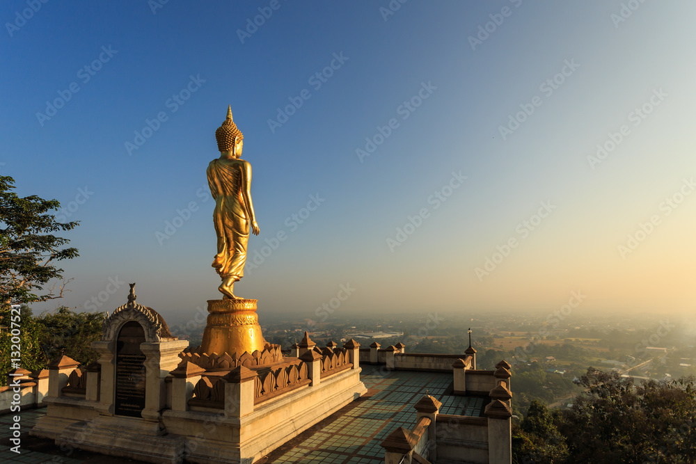 Golden buddha statue in Thai temple, Wat Phra That Khao Noi in N Golden buddha statue in Thai temple, Wat Phra That Khao Noi in N