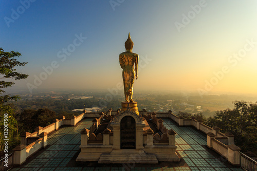 Golden buddha statue in Thai temple, Wat Phra That Khao Noi in N © SKT Studio