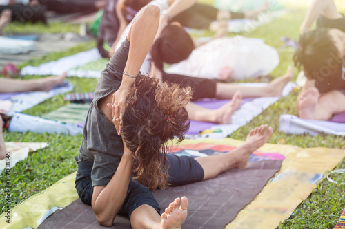 Fototapeta Naklejka Na Ścianę i Meble -  Asian woman doing yoga or exercise in the park