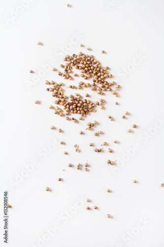 Spices for meat dishes and baking. Whole coriander seeds. White