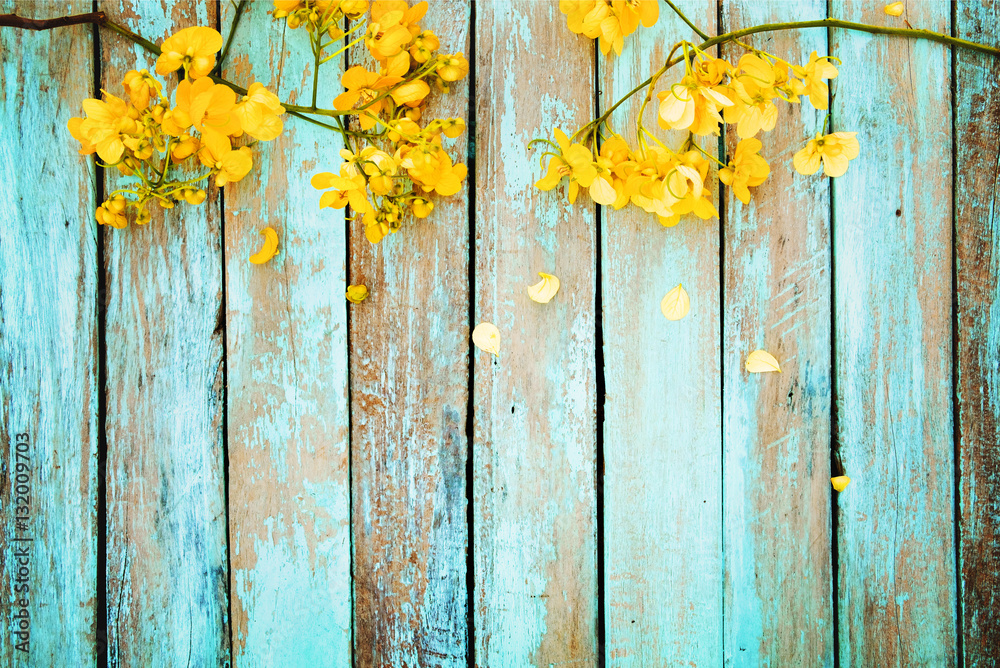 Wall murals Yellow flowers on vintage wooden background, border design.  vintage color tone - concept flower of spring or summer background -  