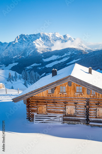Wooden mountain chalet in the alps in winter