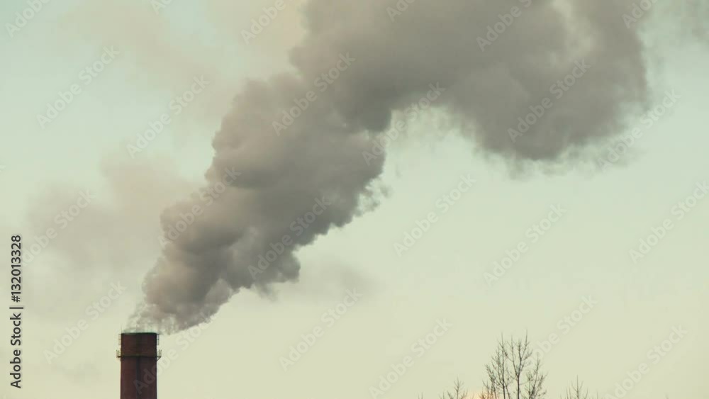 Air pollution by smoke coming out of the factory chimneys in the industrial zone. Air pollution by smoke coming out of the factory chimneys in the industrial zone.