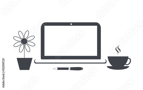 Office desk with coffee cup and flower