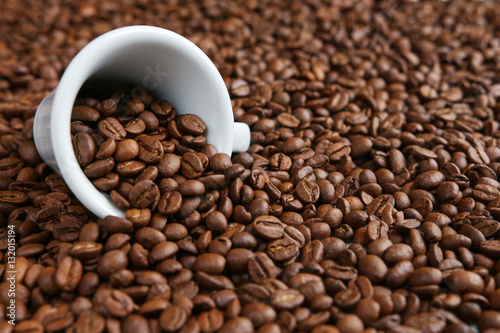 A cup of coffee on beans background