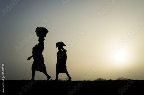 Mozambican ladies in the early morning mist photo