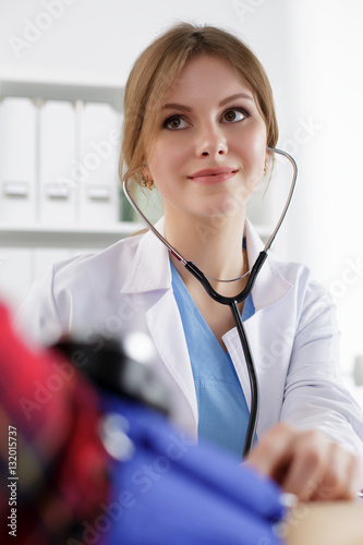 Medicine doctor measuring blood pressure photo