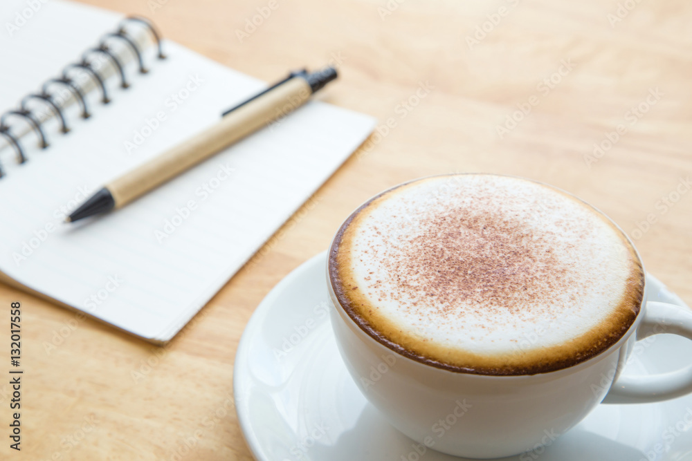 Open notebook with coffee cup. Open notebook with coffee cup.
