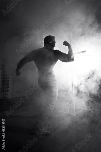 muscular man and abstract smoke